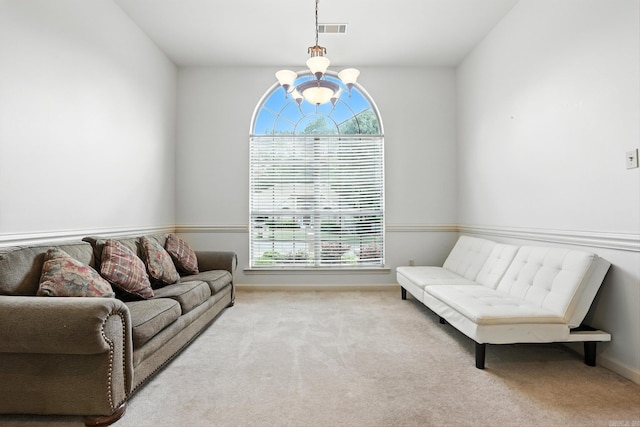 7328 W Ridge Cir, Sherwood, AR 72120 - carpeted living room featuring a chandelier and baseboards