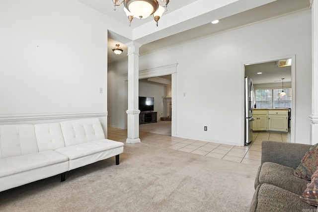 7328 W Ridge Cir, Sherwood, AR 72120 - living room featuring ornate columns, light tile patterned floors, light carpet, and recessed lighting