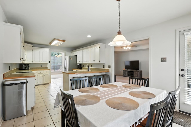 7328 W Ridge Cir, Sherwood, AR 72120 - dining room featuring light tile patterned flooring and recessed lighting
