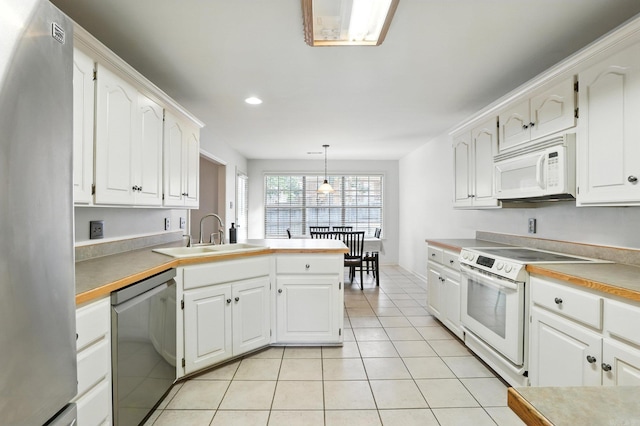7328 W Ridge Cir, Sherwood, AR 72120 - kitchen with appliances with stainless steel finishes, light tile patterned floors, white cabinets, a peninsula, and decorative light fixtures