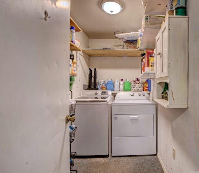 111 Greenland Cv, Little Rock, AR 72204 - laundry room featuring washer and dryer, cabinet space, and carpet floors