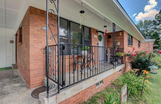 111 Greenland Cv, Little Rock, AR 72204 - property entrance with covered porch and brick siding