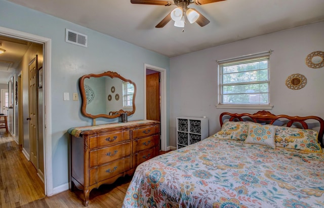 111 Greenland Cv, Little Rock, AR 72204 - bedroom with wood finished floors, attic access, and ceiling fan