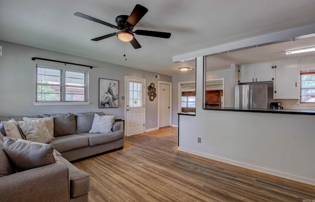 111 Greenland Cv, Little Rock, AR 72204 - living room with wood finished floors and a ceiling fan