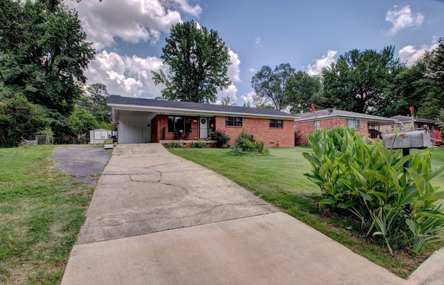 111 Greenland Cv, Little Rock, AR 72204 - ranch-style house featuring driveway, a front yard, brick siding, an attached carport, and covered porch