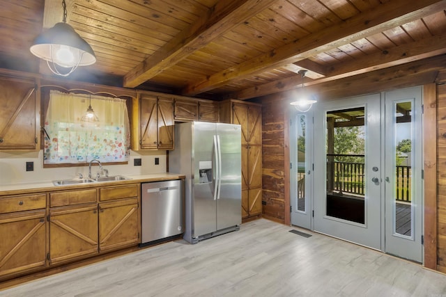 1105 Long Branch Rd, Heber Springs, AR 72543 - kitchen with appliances with stainless steel finishes, a wooden ceiling with exposed beams, brown cabinets, light wood-style floors, and light countertops