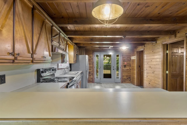 1105 Long Branch Rd, Heber Springs, AR 72543 - kitchen with black electric range oven, a wooden ceiling with exposed beams, under cabinet range hood, wooden walls, and light countertops