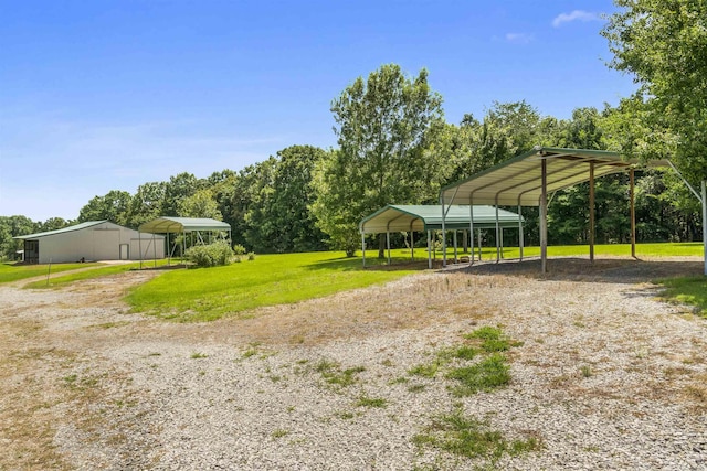 1105 Long Branch Rd, Heber Springs, AR 72543 - view of grassy yard with a detached carport and dirt driveway