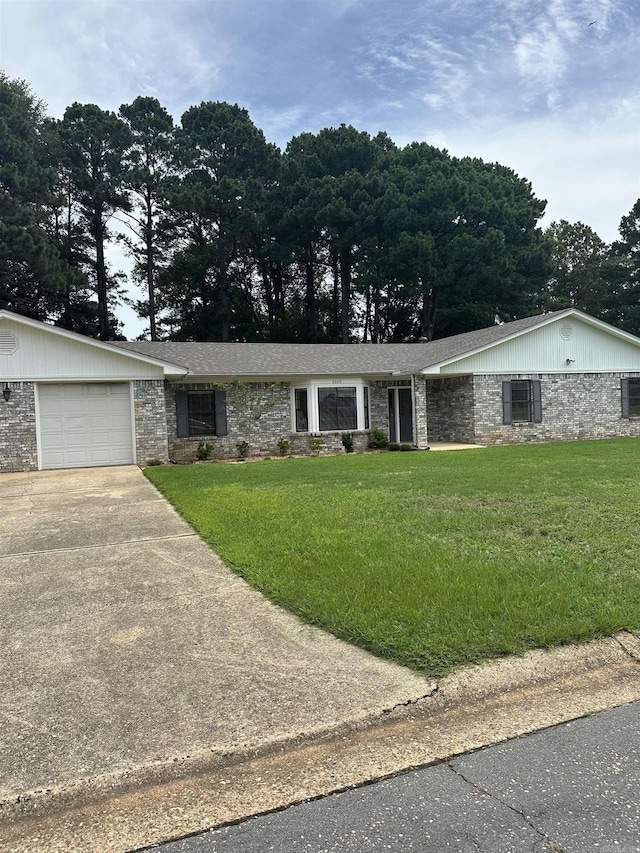 3505 Stockton Dr, Benton, AR 72015 - view of front of property featuring concrete driveway, an attached garage, a front yard, and stone siding