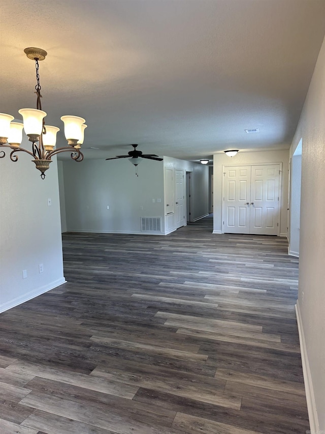 3505 Stockton Dr, Benton, AR 72015 - unfurnished living room with ceiling fan, a chandelier, and dark wood-style floors
