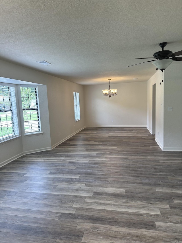 3505 Stockton Dr, Benton, AR 72015 - spare room featuring a chandelier, a textured ceiling, a ceiling fan, and dark wood-style flooring