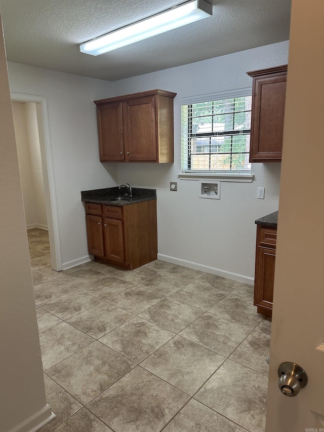 3505 Stockton Dr, Benton, AR 72015 - washroom featuring washer hookup, cabinet space, a textured ceiling, and light tile patterned flooring