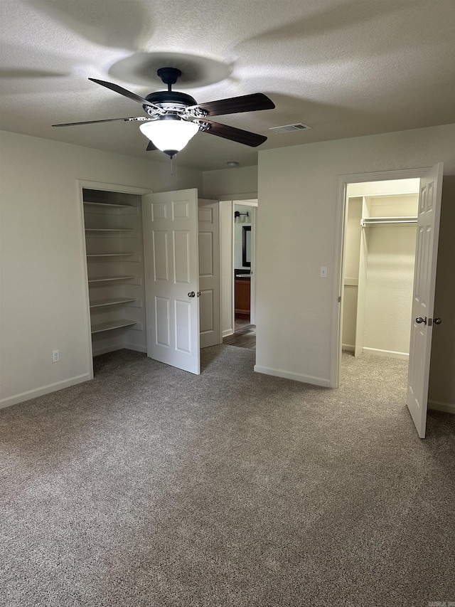 3505 Stockton Dr, Benton, AR 72015 - unfurnished bedroom featuring a closet, carpet, a textured ceiling, and a ceiling fan