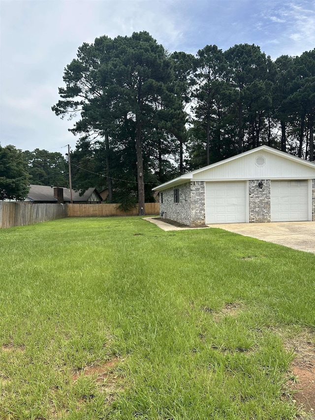 3505 Stockton Dr, Benton, AR 72015 - view of yard featuring a garage