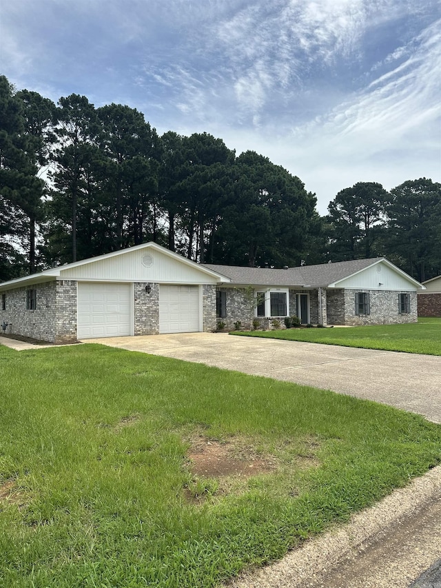 3505 Stockton Dr, Benton, AR 72015 - ranch-style house featuring stone siding, a front lawn, an attached garage, concrete driveway, and view of scattered trees