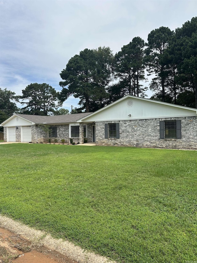 3505 Stockton Dr, Benton, AR 72015 - ranch-style house with a front lawn, stone siding, and a garage