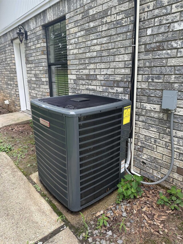3505 Stockton Dr, Benton, AR 72015 - exterior view of a cooling unit and stone siding