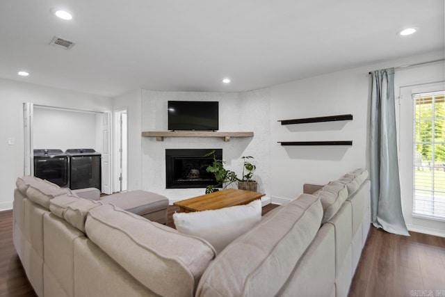 26 Buttermilk Rd, Little Rock, AR 72227 - living room featuring washing machine and clothes dryer, dark wood-type flooring, recessed lighting, and a fireplace