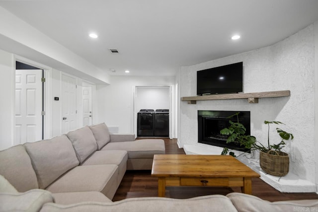 26 Buttermilk Rd, Little Rock, AR 72227 - living area featuring wood finished floors, recessed lighting, washer and clothes dryer, and a fireplace
