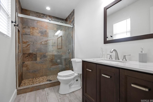 26 Buttermilk Rd, Little Rock, AR 72227 - full bath featuring vanity, a shower stall, and wood finished floors