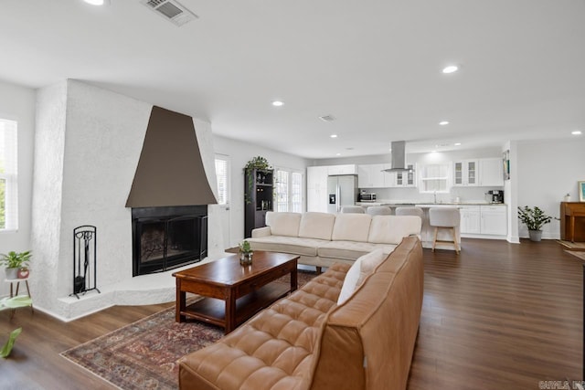 26 Buttermilk Rd, Little Rock, AR 72227 - living room with dark wood-style floors, recessed lighting, and a large fireplace