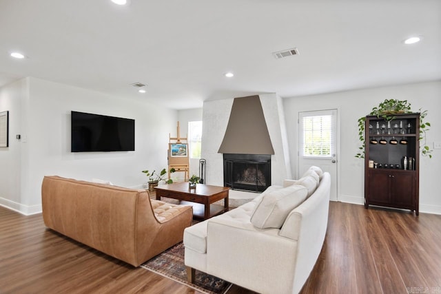 26 Buttermilk Rd, Little Rock, AR 72227 - living area featuring healthy amount of natural light, wood finished floors, a fireplace, and recessed lighting