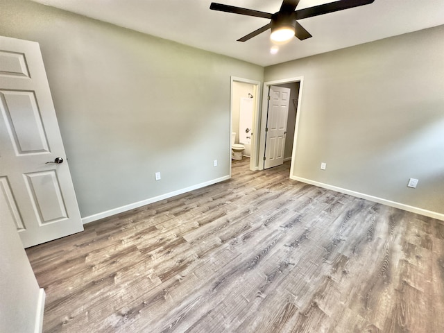 377 N 3rd St Unit B, Black Rock, AR 72415 - unfurnished bedroom with wood finished floors, ensuite bathroom, and ceiling fan
