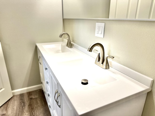 377 N 3rd St Unit B, Black Rock, AR 72415 - bathroom featuring double vanity and wood finished floors