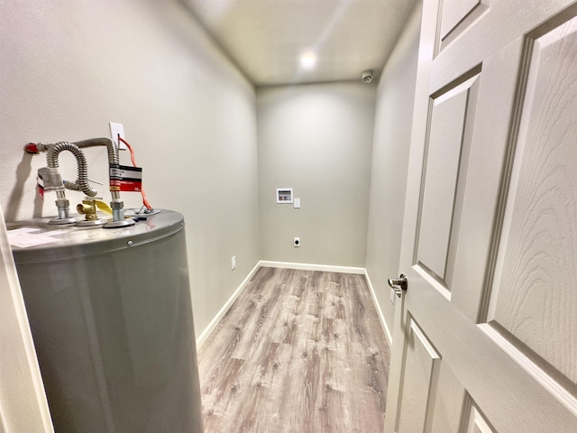 377 N 3rd St Unit B, Black Rock, AR 72415 - laundry room featuring light wood-style flooring, water heater, hookup for an electric dryer, and washer hookup