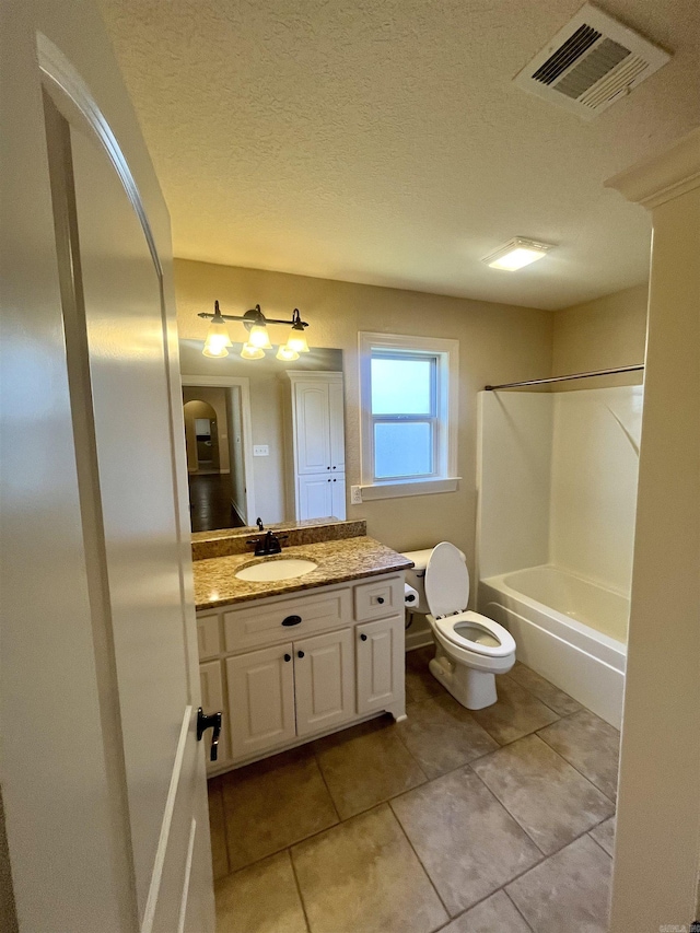 24 Tradewinds Dr, Cabot, AR 72023 - bathroom featuring vanity, tile patterned floors, shower / tub combination, and a textured ceiling