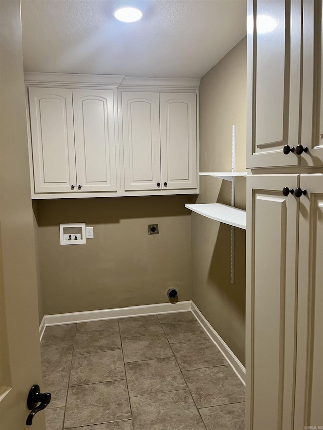 24 Tradewinds Dr, Cabot, AR 72023 - laundry area with electric dryer hookup, hookup for a washing machine, tile patterned floors, and cabinet space