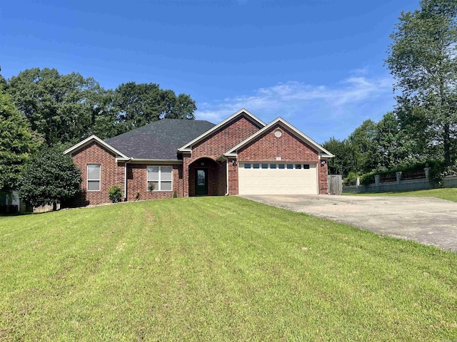 24 Tradewinds Dr, Cabot, AR 72023 - ranch-style house with an attached garage, concrete driveway, brick siding, and roof with shingles