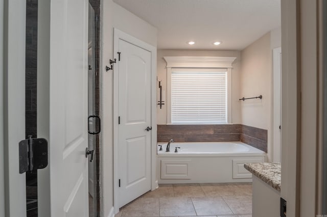 24 Tradewinds Dr, Cabot, AR 72023 - bathroom with a garden tub, tile patterned flooring, vanity, recessed lighting, and a shower stall