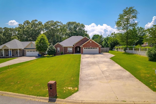 24 Tradewinds Dr, Cabot, AR 72023 - view of front of home with driveway, brick siding, and a garage