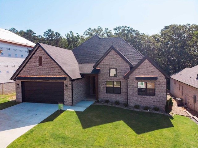 15112 Matterhorn Loop, Maumelle, AR 72113 - view of front of home with a garage, brick siding, a front yard, and driveway