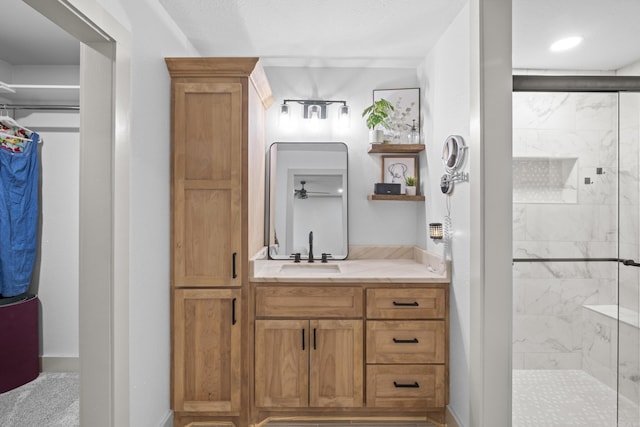 60 Pin Oak Dr, Lonoke, AR 72086 - bathroom with a shower stall, vanity, and a ceiling fan