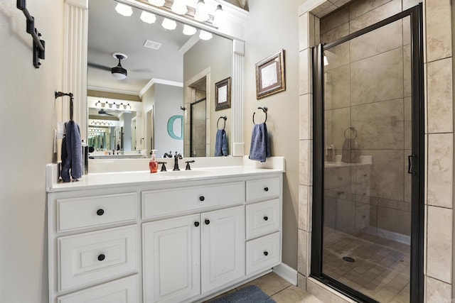 28 Chemin Ct, Little Rock, AR 72223 - full bath with ornamental molding, a stall shower, tile patterned floors, vanity, and ceiling fan