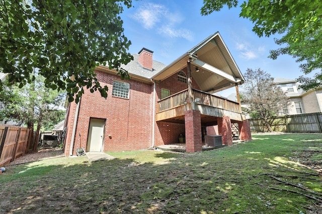 28 Chemin Ct, Little Rock, AR 72223 - rear view of house featuring brick siding, a fenced backyard, stairway, and a deck