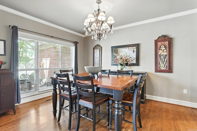 28 Chemin Ct, Little Rock, AR 72223 - dining room with a chandelier, crown molding, and wood finished floors