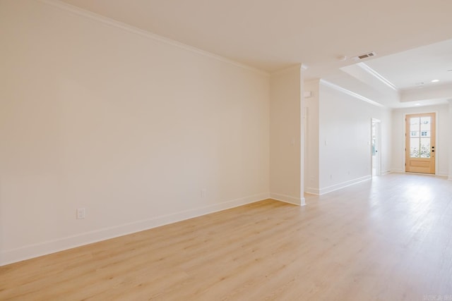 127 Edgewood Cir, Little Rock, AR 72223 - empty room with crown molding, light wood-style floors, and a raised ceiling