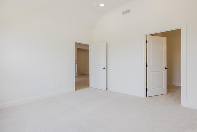 127 Edgewood Cir, Little Rock, AR 72223 - unfurnished bedroom featuring light colored carpet and vaulted ceiling