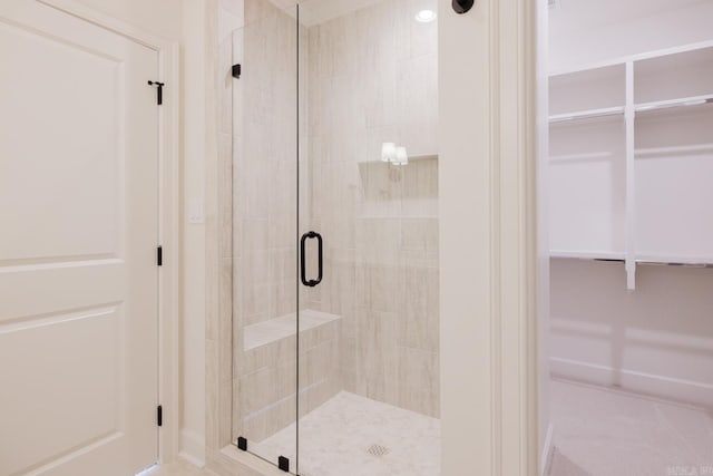127 Edgewood Cir, Little Rock, AR 72223 - bathroom featuring a stall shower and a spacious closet