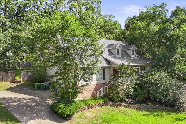69 Saint Thomas Cir, Little Rock, AR 72211 - view of side of property with brick siding and driveway