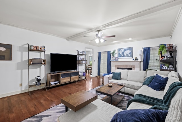 69 Saint Thomas Cir, Little Rock, AR 72211 - living area featuring wood finished floors, ceiling fan, crown molding, a tile fireplace, and beam ceiling