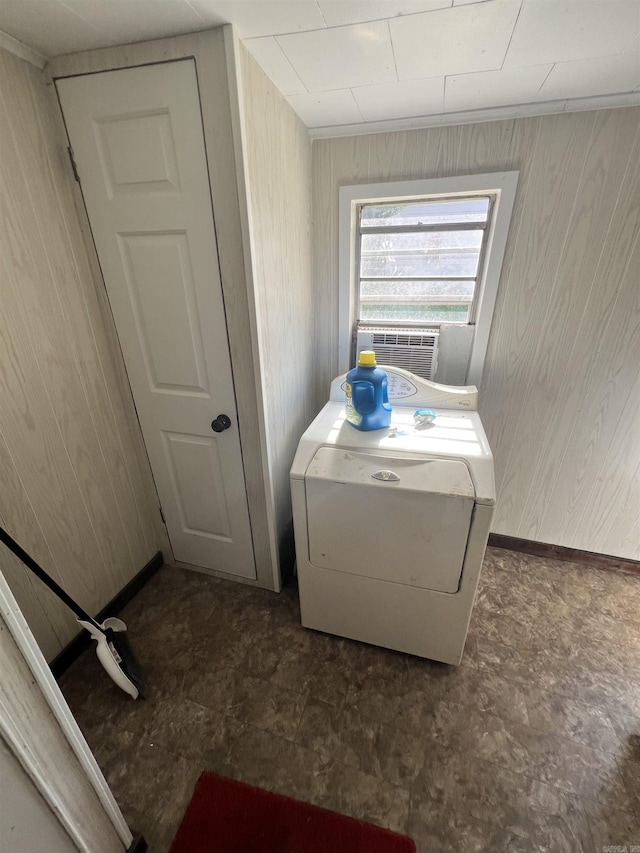 laundry area featuring washer / clothes dryer, cooling unit, and wooden walls