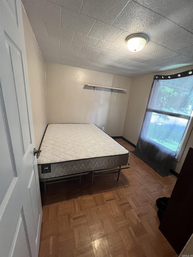bedroom featuring baseboards