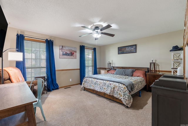 105 Little Creek Rd, Sherwood, AR 72120 - carpeted bedroom with multiple windows, ceiling fan, and a textured ceiling