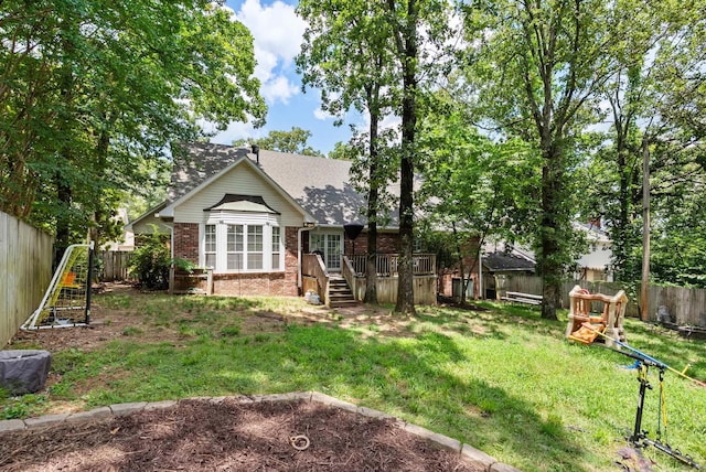 105 Little Creek Rd, Sherwood, AR 72120 - back of house with brick siding, a wooden deck, a fenced backyard, stairs, and roof with shingles