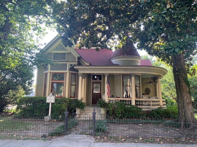 1701 Arch St, Little Rock, AR 72206 - victorian home featuring covered porch, a fenced front yard, and ceiling fan