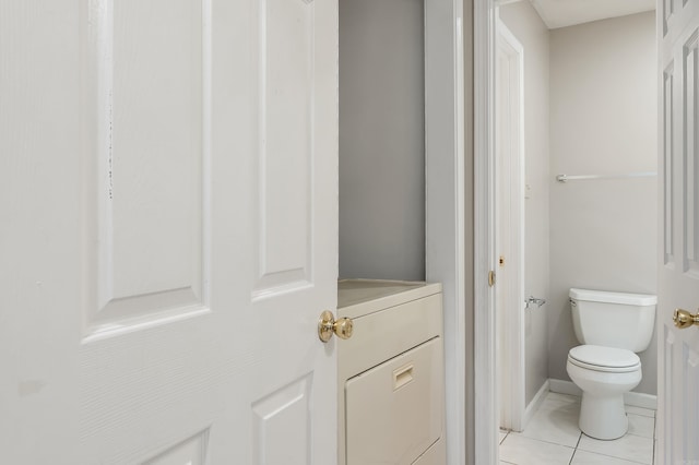 1607 W Washington Ave, Jonesboro, AR 72401 - bathroom with tile patterned flooring and washer / dryer